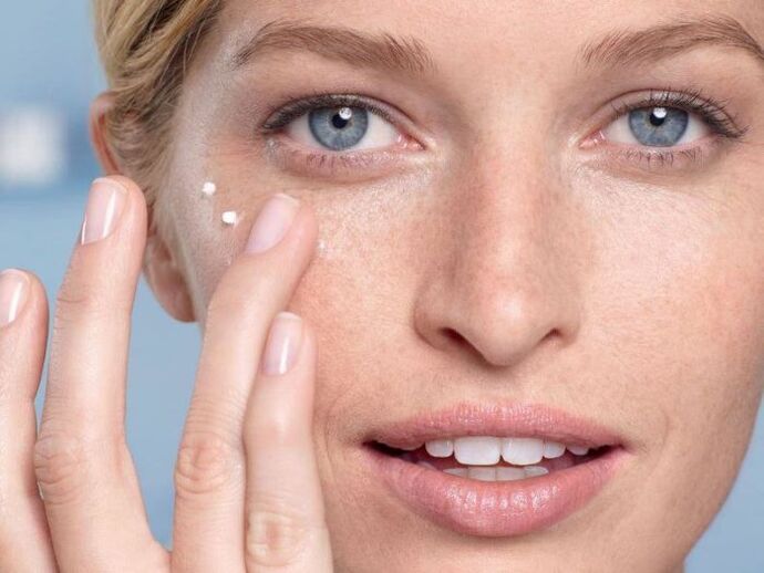 apply a cream to rejuvenate the skin around the eyes